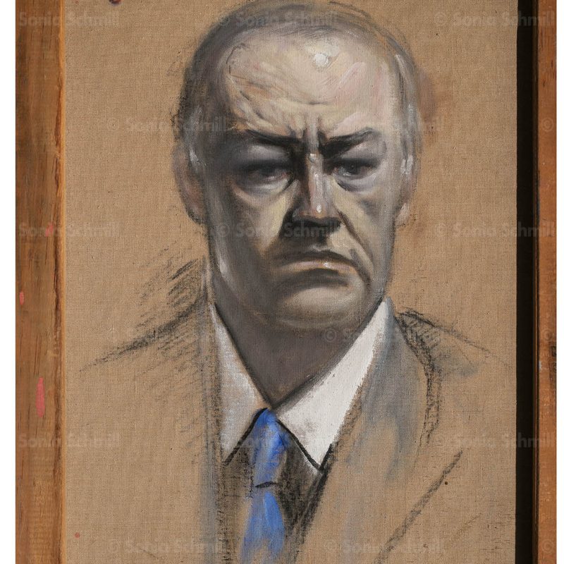 Portrait of a stern man in suit.